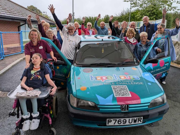 Alan and Wendy Jarrett as they set off from Hope House, along with other classic car enthusiasts who have donated to their challenge, as well as Hope House Activity Lead Sarah Daniels who is with Willow