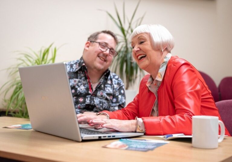 Digital volunteer Chris Webster and Digital Skills Programme participant Tonia Roberts enjoy a digital support session at Shrewsbury’s Roy Fletcher Centre