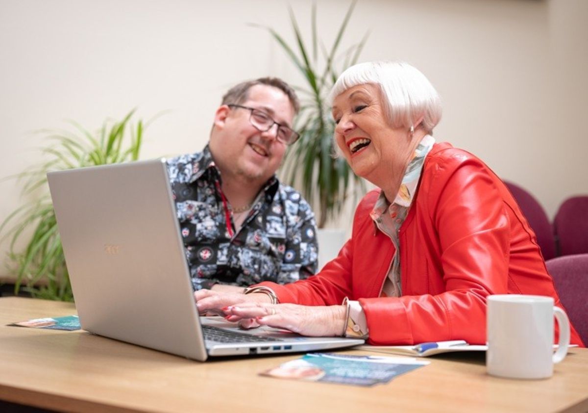 Digital volunteer Chris Webster and Digital Skills Programme participant Tonia Roberts enjoy a digital support session at Shrewsbury’s Roy Fletcher Centre