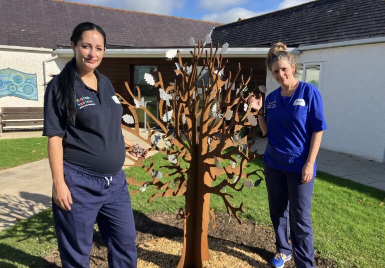From left, hospice nurses Amy Williams and Gemma Jones with the Community Tree
