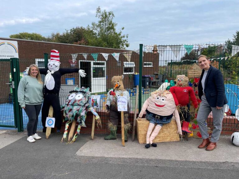 Harriet Smith from Lilleshall Primary School and Lilleshall Pre School with scarecrows donated to Linda Harris from Apley Farm Shop