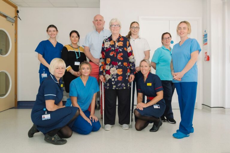 Ruth Denney with Consultant Mr Niall Graham, and some of the clinical team that cared for her during her patient journey at RJAH.
