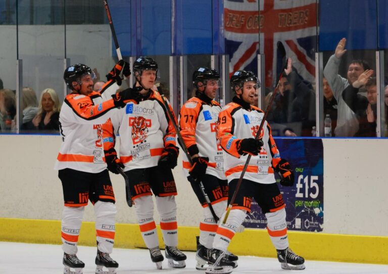 A group celebration following a goal. Photo: Edward Bowen / ebphotography