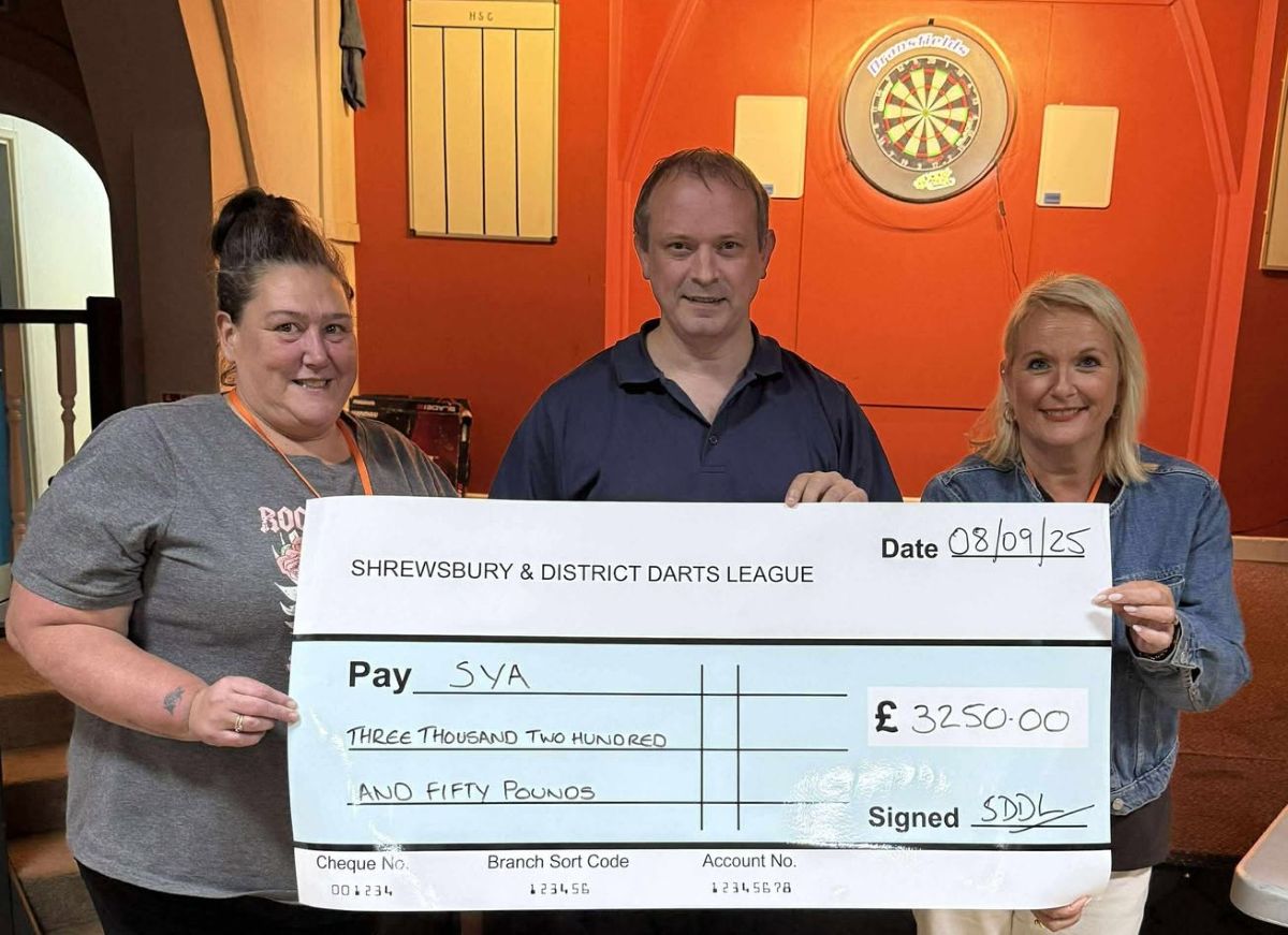 Lisa Farley and Kerry Williams of SYA with Neil Evans, of Shrewsbury and District Darts League