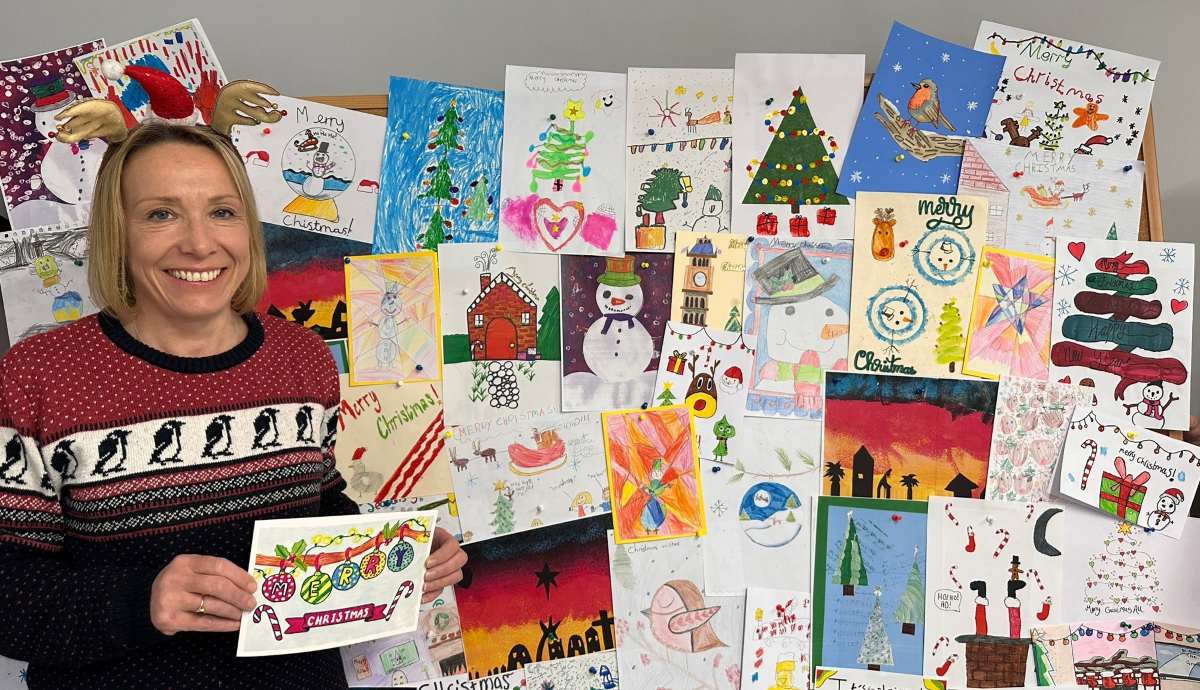 Helen Morgan MP with Christmas card competition entries