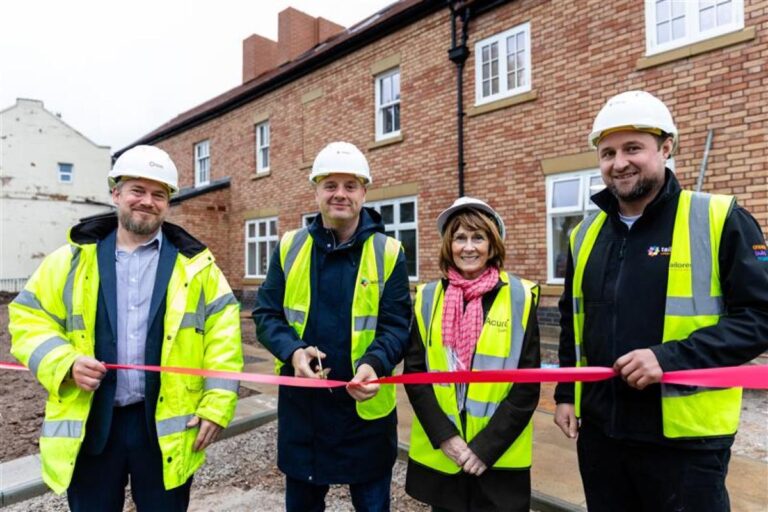 A photo of the opening of Lion House which features 11 self-contained apartments, a large communal area and dedicated staff office and facilities