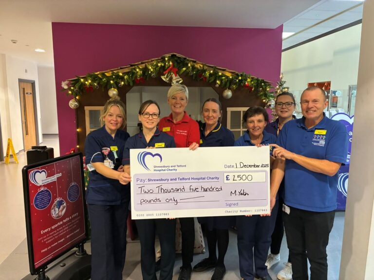 The children’s ward team in front of the grotto with volunteer Mike Yates, who raised over £2,500 through a charity concert to kickstart the campaign