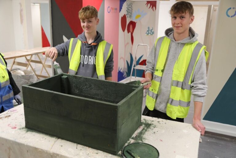Construction students Lucas Davies and Tyler Klimkowski building the planters