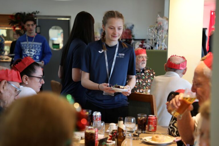 Caption: Telford College students serving a festive feast to members of the Dawley Dinner group at the college’s Orange Tree restaurant in Wellington