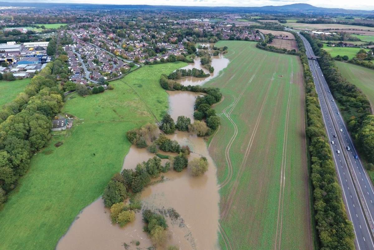 An aerial view of the proposed development land, which is to the right of the flooded Rea Brook in the photograph