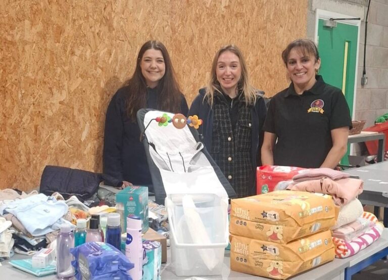 Leanne Simcoe, Founder & CEO, Little Stars, Hannah Stoddart, Operations Manager, Little Stars and Julie Kaur, Jules Convenience, with items waiting to go out to one family.