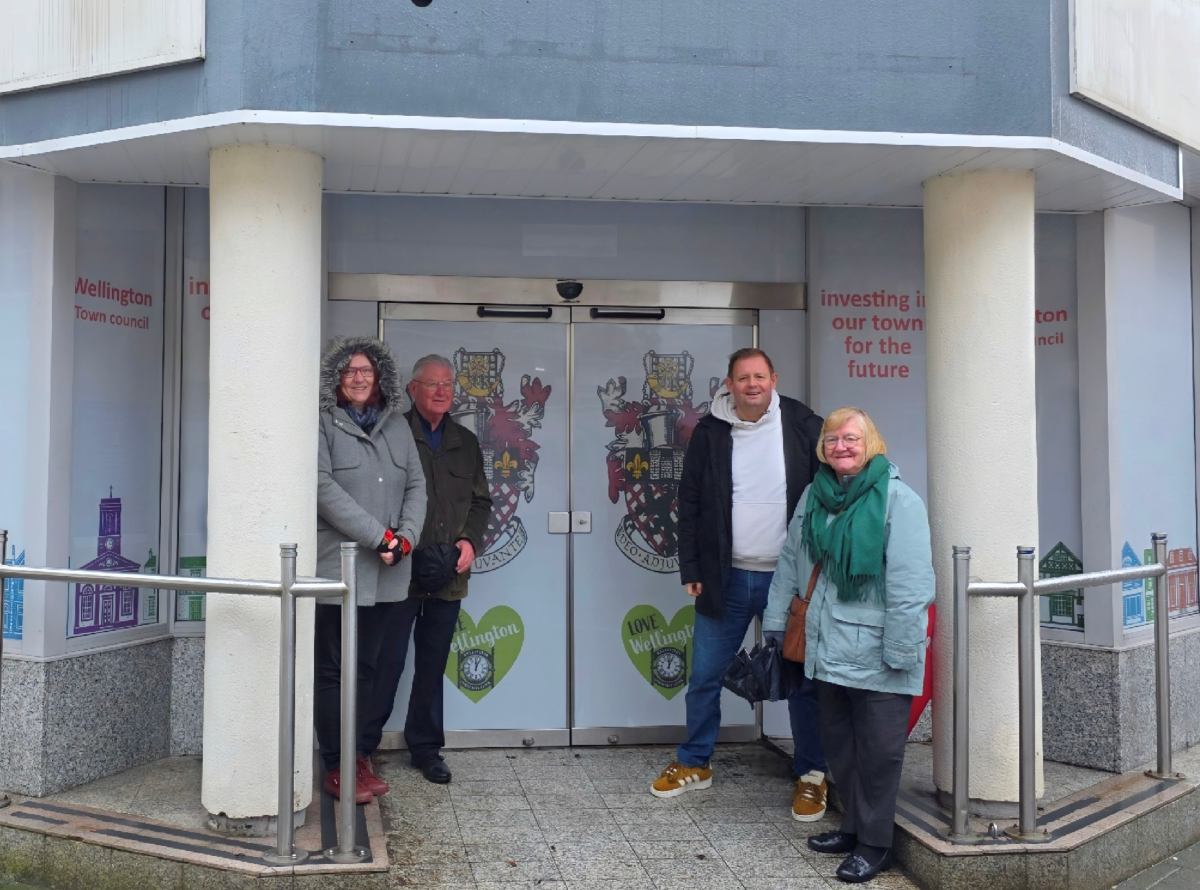 Cllrs Emma Holding, Jim McGinn, Paul Davis and Joan Gorse in front of the new vinyls at the Halifax